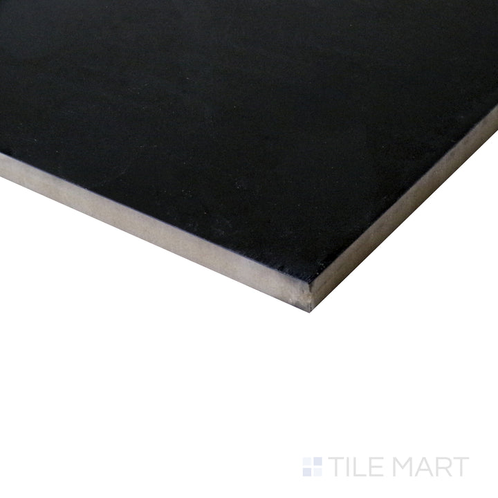 Side shot emphasizing the deep, glossy finish of Pearl Super Black 24X48 polished porcelain tile.