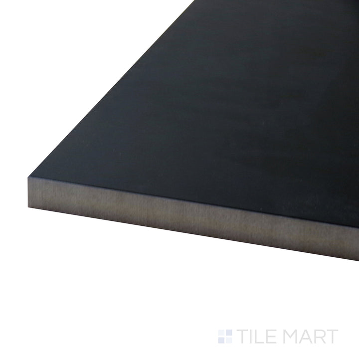 A corner shot of the Pearl Super Black 24x48 polished porcelain tile highlights its deep black tone and high-gloss finish, creating a bold and dramatic statement.