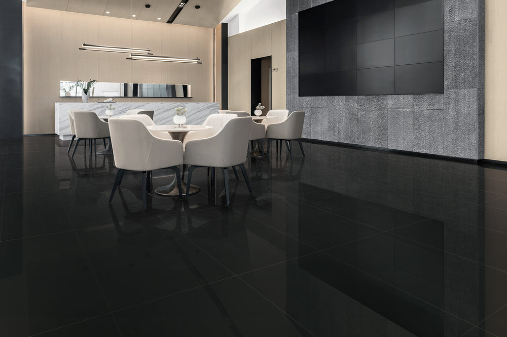 A bold and dramatic interior featuring Pearl Super Black 24X48 polished porcelain, offering a stunning contrast with a sleek and reflective finish.