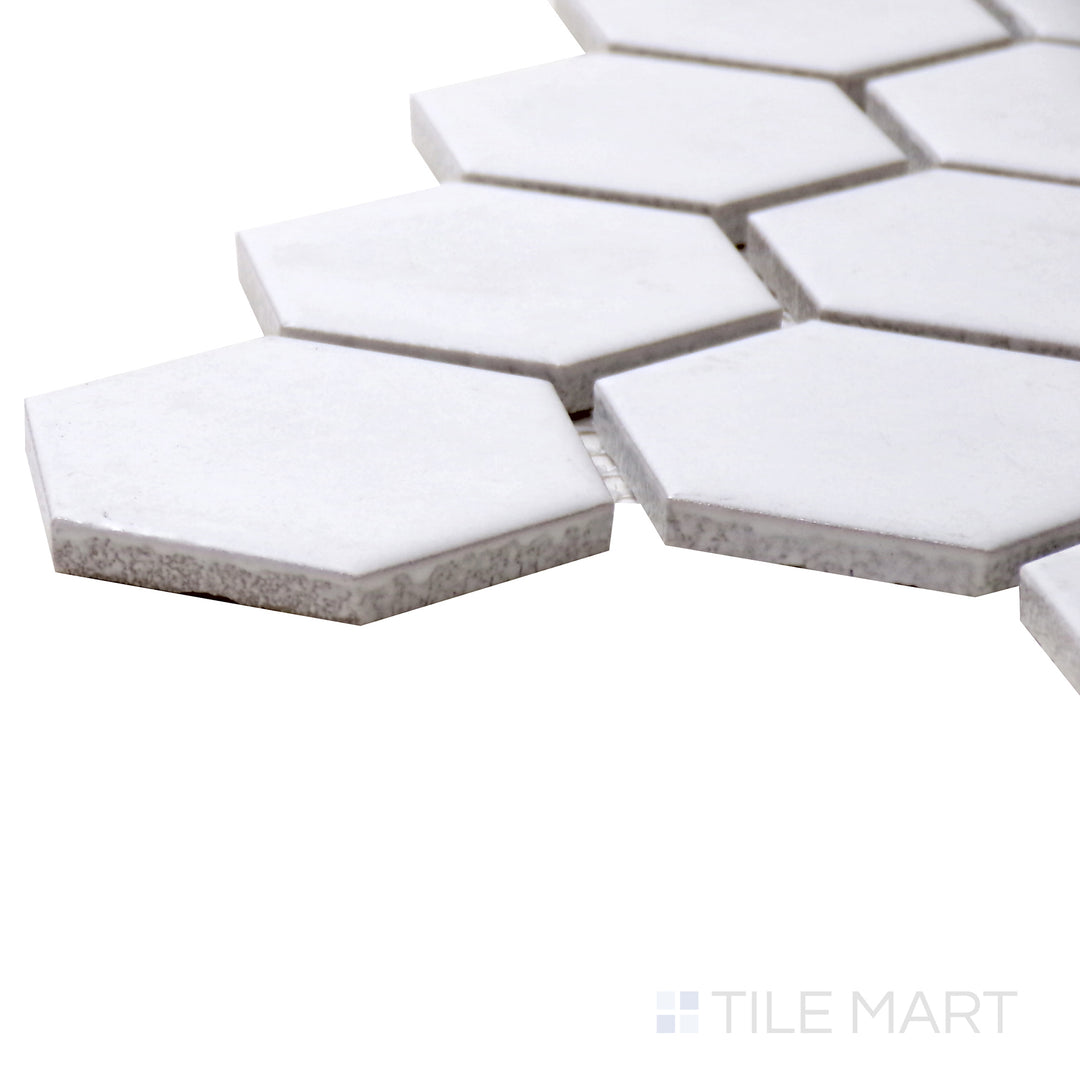A corner perspective of the Porcelain Glazed Mosaics White 2" hexagon matte tile highlights its bright white shade and subtle texture, delivering a fresh and timeless appeal.