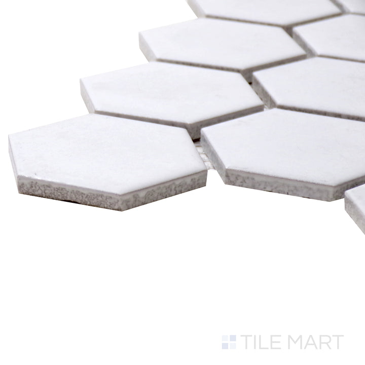 A corner perspective of the Porcelain Glazed Mosaics White 2" hexagon matte tile highlights its bright white shade and subtle texture, delivering a fresh and timeless appeal.