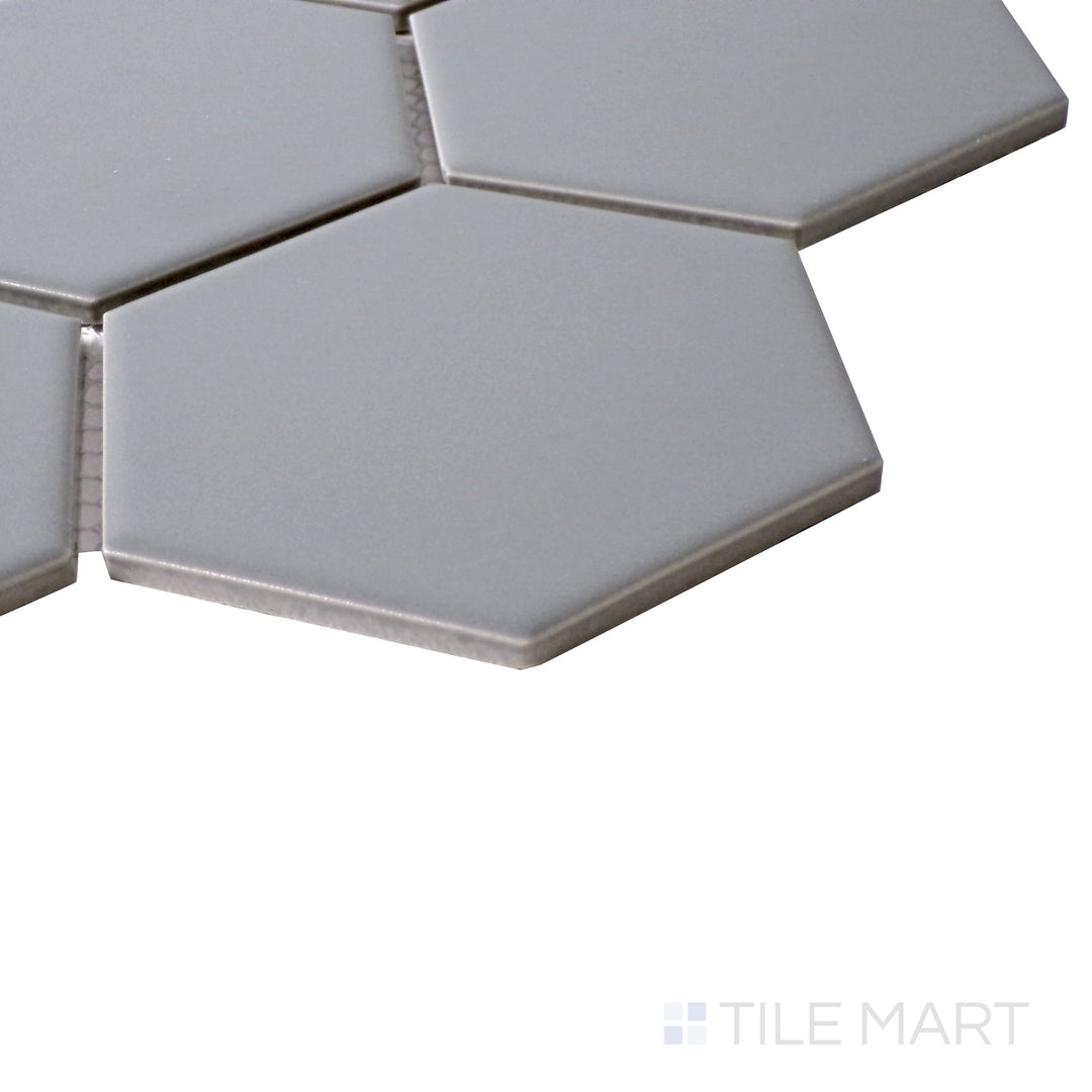 Side perspective highlighting the sleek, neutral tone of Porcelain Glazed Gray 4" Hexagon Matte mosaic.