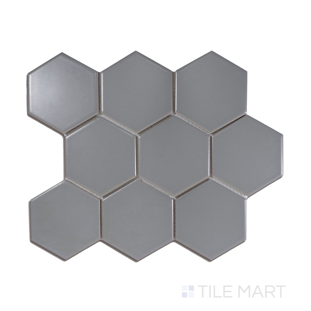 A modern gray 4-inch hexagonal matte porcelain mosaic, with a contemporary geometric style, displayed from above to emphasize its structured form.