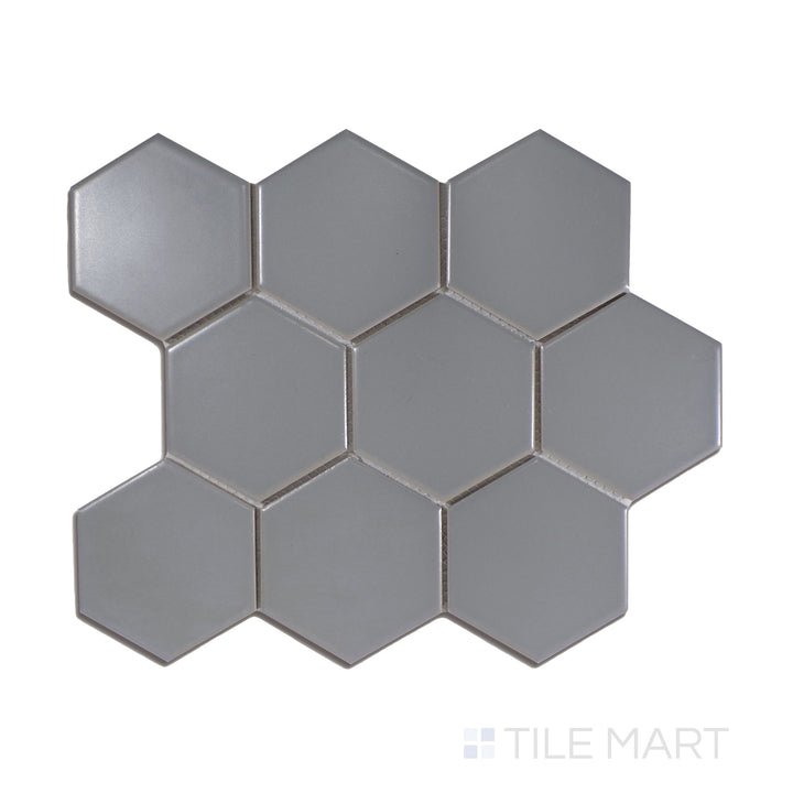 A modern gray 4-inch hexagonal matte porcelain mosaic, with a contemporary geometric style, displayed from above to emphasize its structured form.