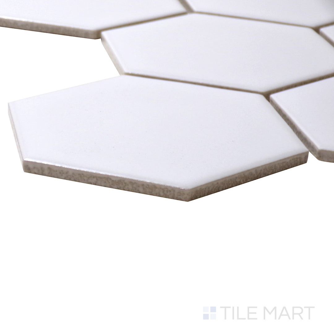 A corner perspective of the Porcelain Glazed Mosaics White 4" hexagon matte tile highlights its classic white color and hexagonal pattern, offering a clean and minimalist aesthetic.