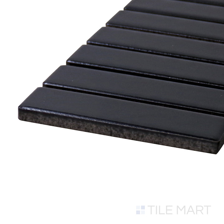 Captured from a corner angle, the Porcelain Glazed Mosaics Black Grid matte tile showcases its grid layout and deep black finish, creating a sleek and structured visual effect.