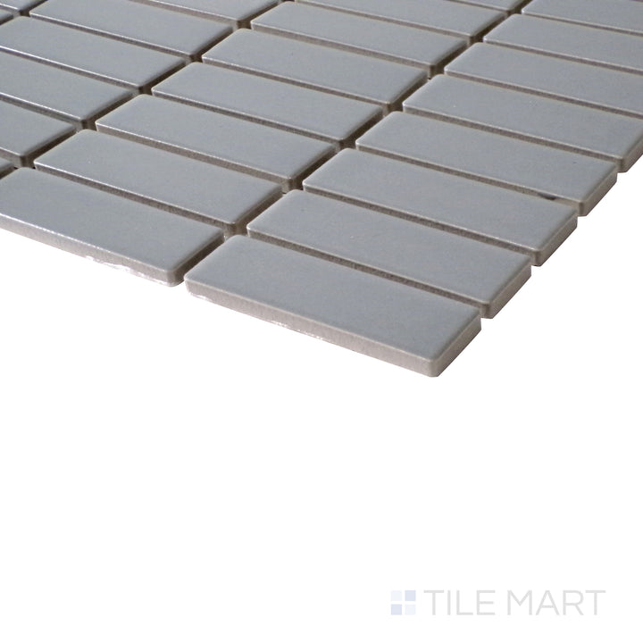 Side perspective emphasizing the subtle texture of Porcelain Glazed Gray Grid Matte mosaic.