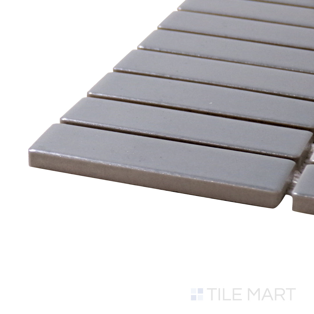 A corner perspective of the Porcelain Glazed Mosaics Gray Grid matte tile highlights its muted gray shade and geometric pattern, adding depth and interest to interiors.