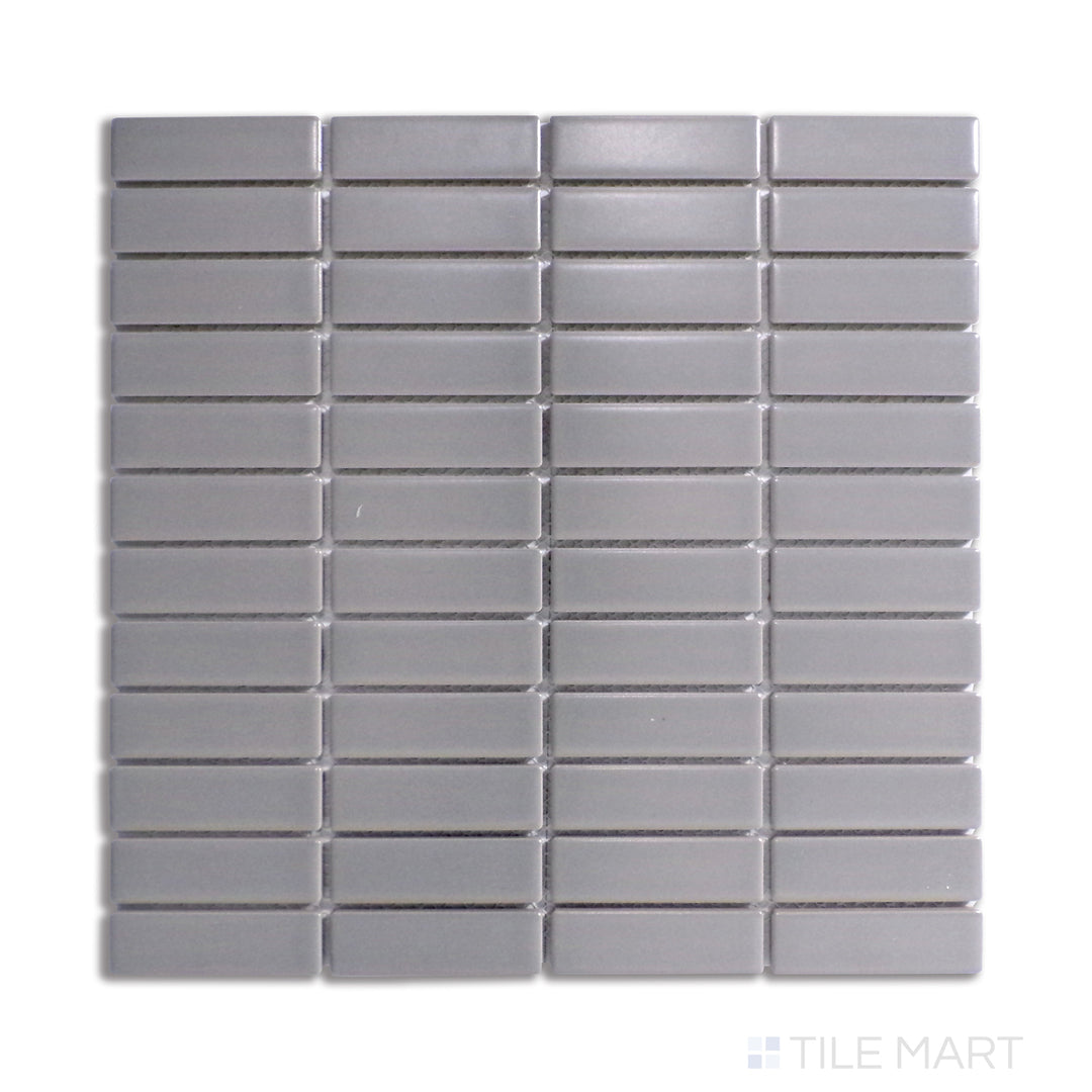 A sophisticated gray matte porcelain mosaic arranged in a structured grid, viewed from a top-down angle to emphasize its balanced, contemporary style.