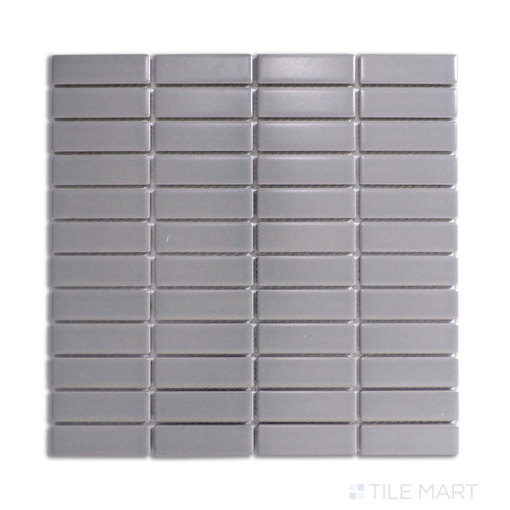 A sophisticated gray matte porcelain mosaic arranged in a structured grid, viewed from a top-down angle to emphasize its balanced, contemporary style.