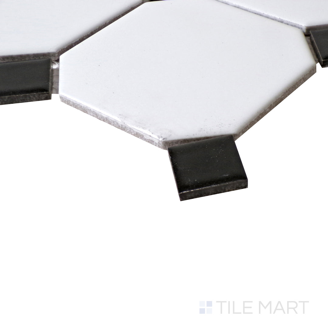 An angled view showcasing the elegant contrast of White Octagon Matte tiles with Black Dot accents.
