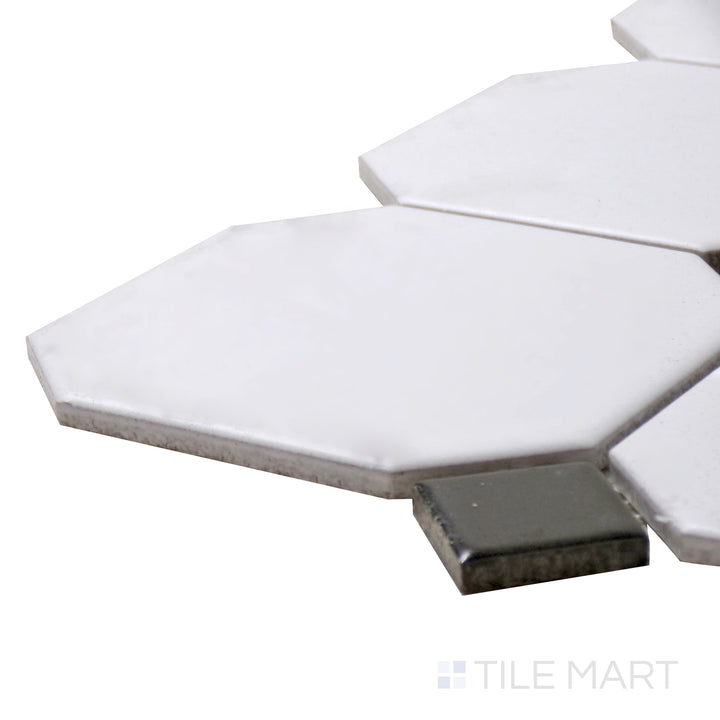 Captured from a corner angle, the Porcelain Glazed Mosaics White With Black Dot 4" Octagon Matte tile showcases its larger format octagonal design, creating a vintage-inspired look.