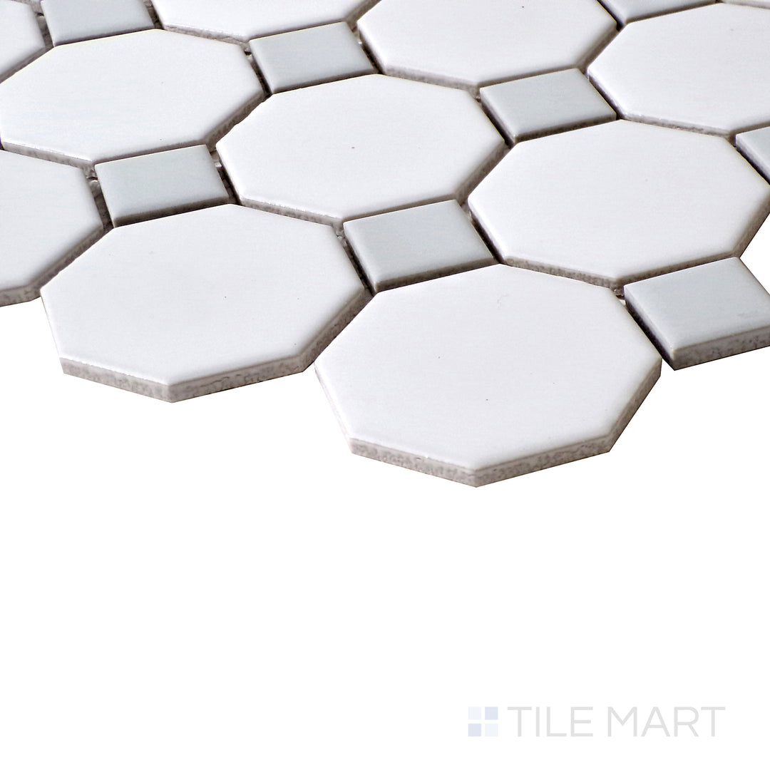 A close-up shot highlighting the timeless design of White Octagon Matte mosaics with subtle Gray Dot details.