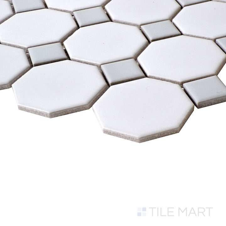 A close-up shot highlighting the timeless design of White Octagon Matte mosaics with subtle Gray Dot details.