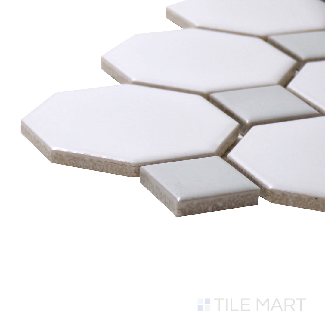 A corner perspective of the Porcelain Glazed Mosaics White With Gray Dot 2" Octagon Matte tile highlights its delicate gray accents and elegant octagonal shape.