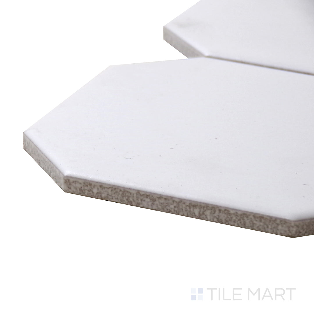 A corner shot of the Porcelain Glazed Mosaics White With Gray Dot 4" Octagon Matte tile showcases its timeless octagonal design, featuring soft gray dot details.