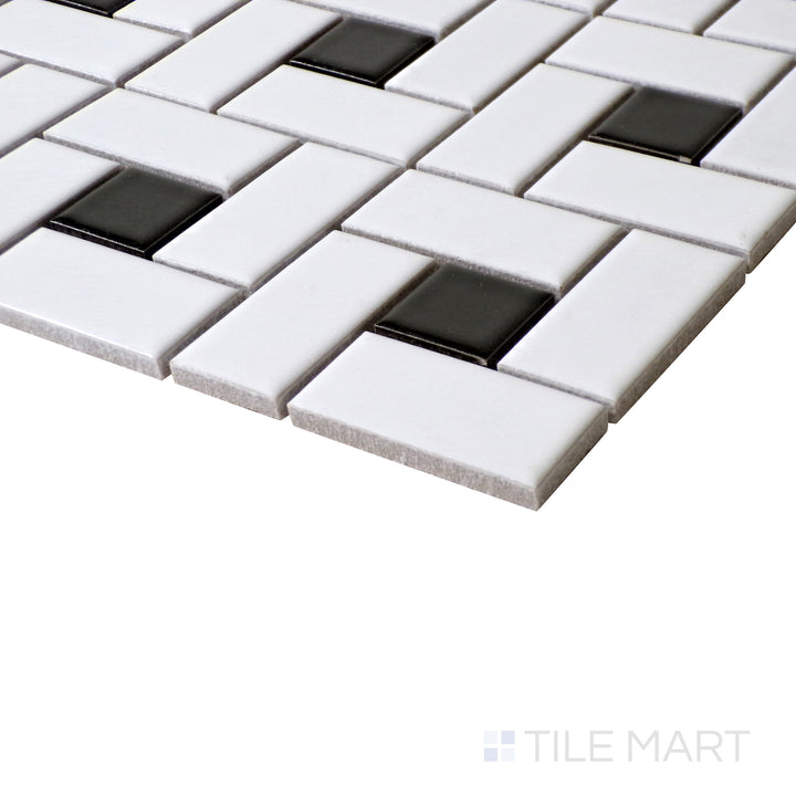 A detailed angled view of White Pinwheel Matte mosaics with bold Black Dot accents, creating a striking geometric pattern.