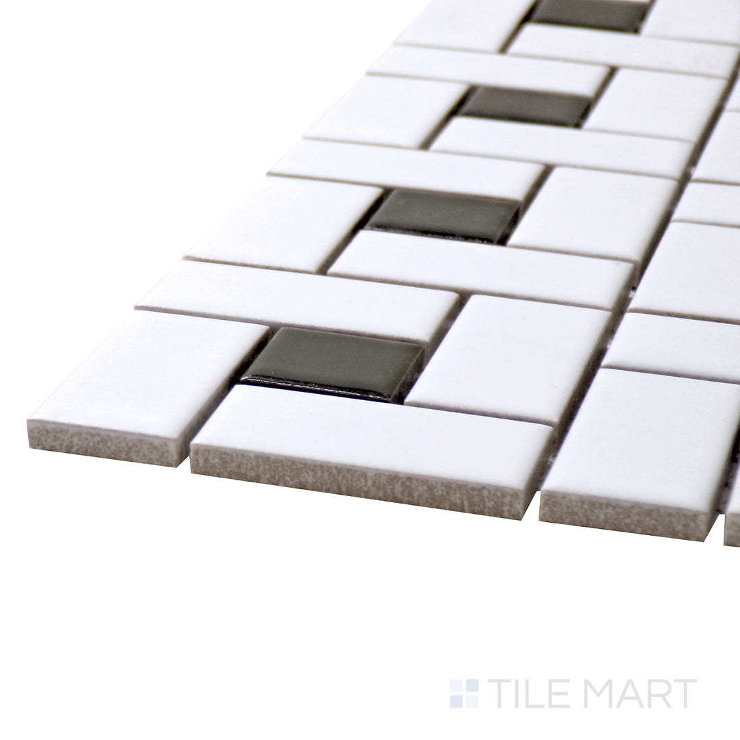 Captured from a corner angle, the Porcelain Glazed Mosaics White With Black Dot Pinwheel Matte tile presents a unique pinwheel pattern with striking black accents.