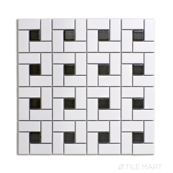 Bird’s-eye view of pinwheel-style porcelain mosaic tiles, combining white matte tiles with black dot accents for a striking yet timeless pattern.