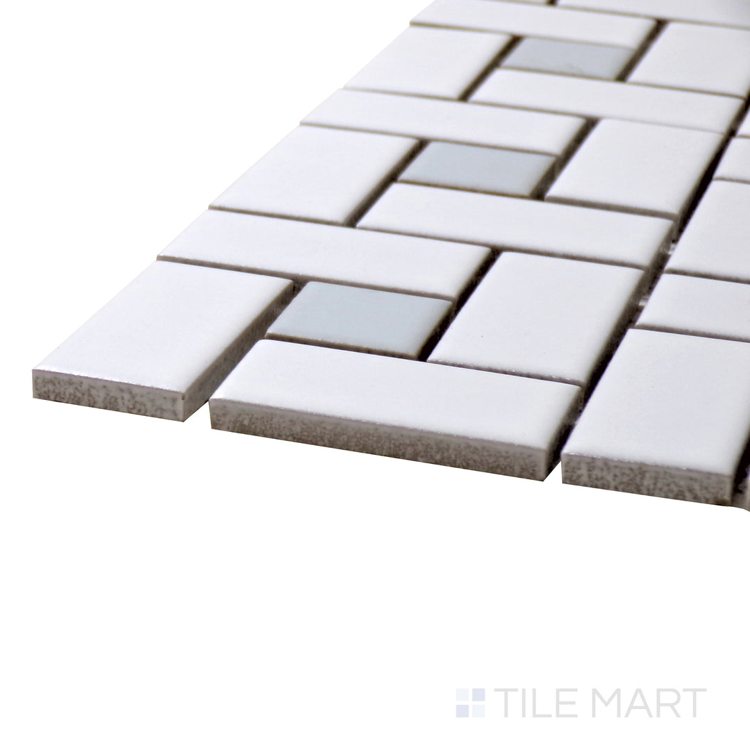 A corner perspective of the Porcelain Glazed Mosaics White With Gray Dot Pinwheel Matte tile showcases its intricate pinwheel layout, adding texture and interest to any space.