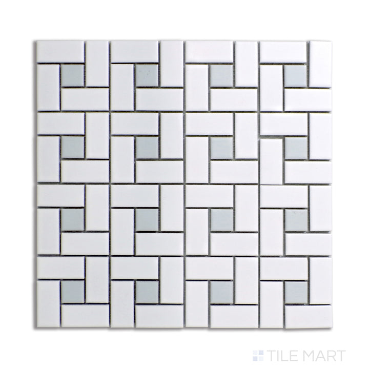 Top-down angle of a white pinwheel mosaic tile design, featuring matte-finished porcelain with delicate gray dot accents for a neutral aesthetic.