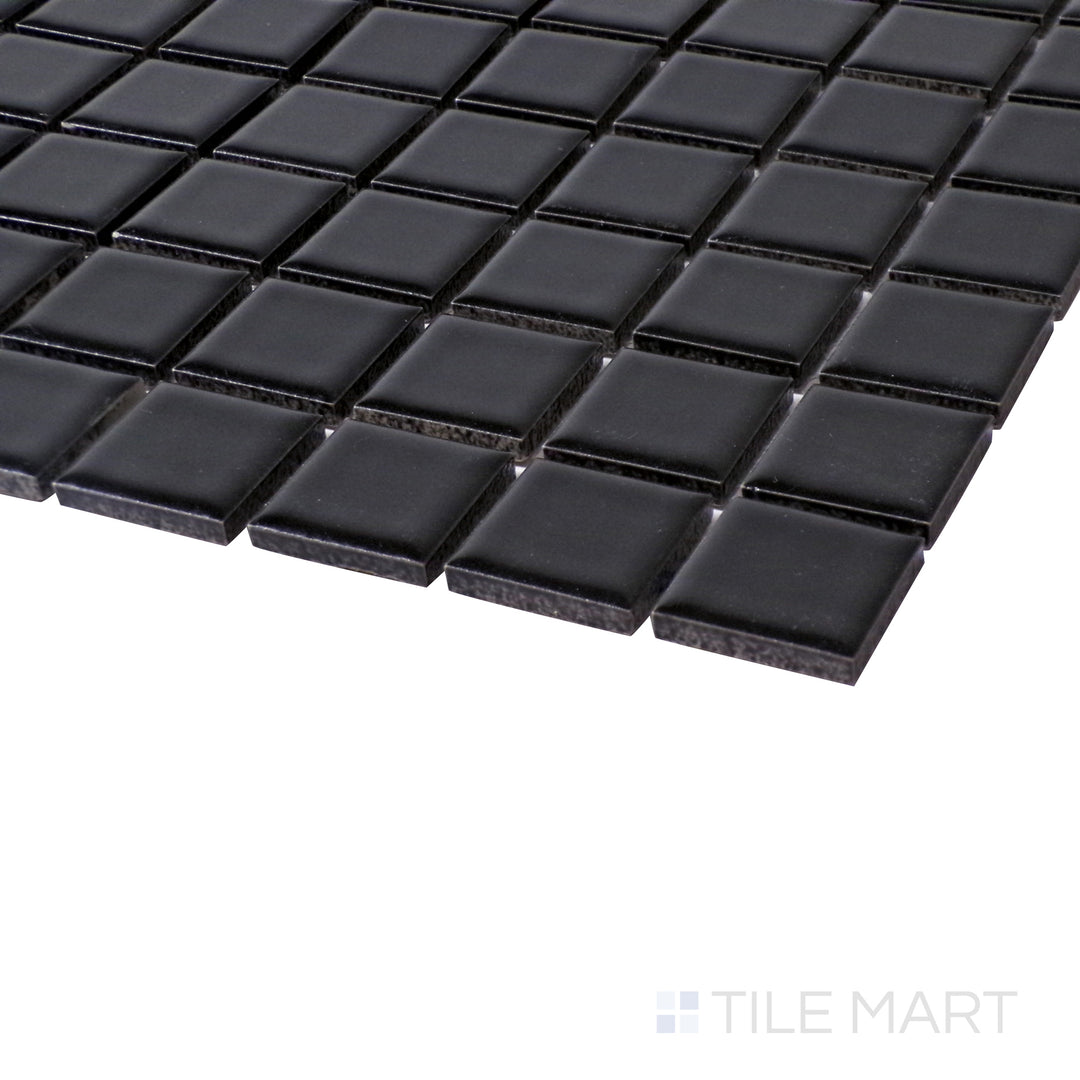 Close-up angle showing the rich depth of Porcelain Glazed Black 1" Square Matte mosaic.