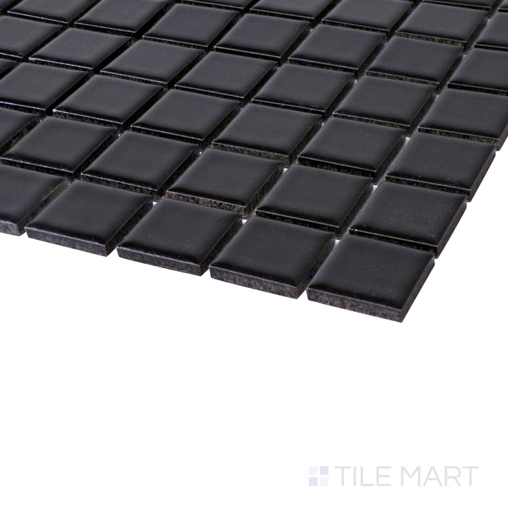 Close-up angle showing the rich depth of Porcelain Glazed Black 1" Square Matte mosaic.