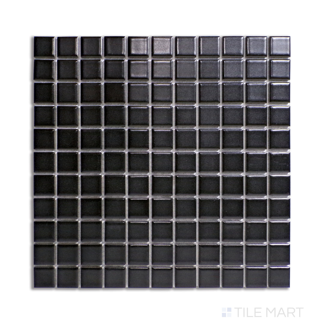 Top-down view of 1-inch square black matte porcelain mosaic tiles, creating a bold and contemporary aesthetic.