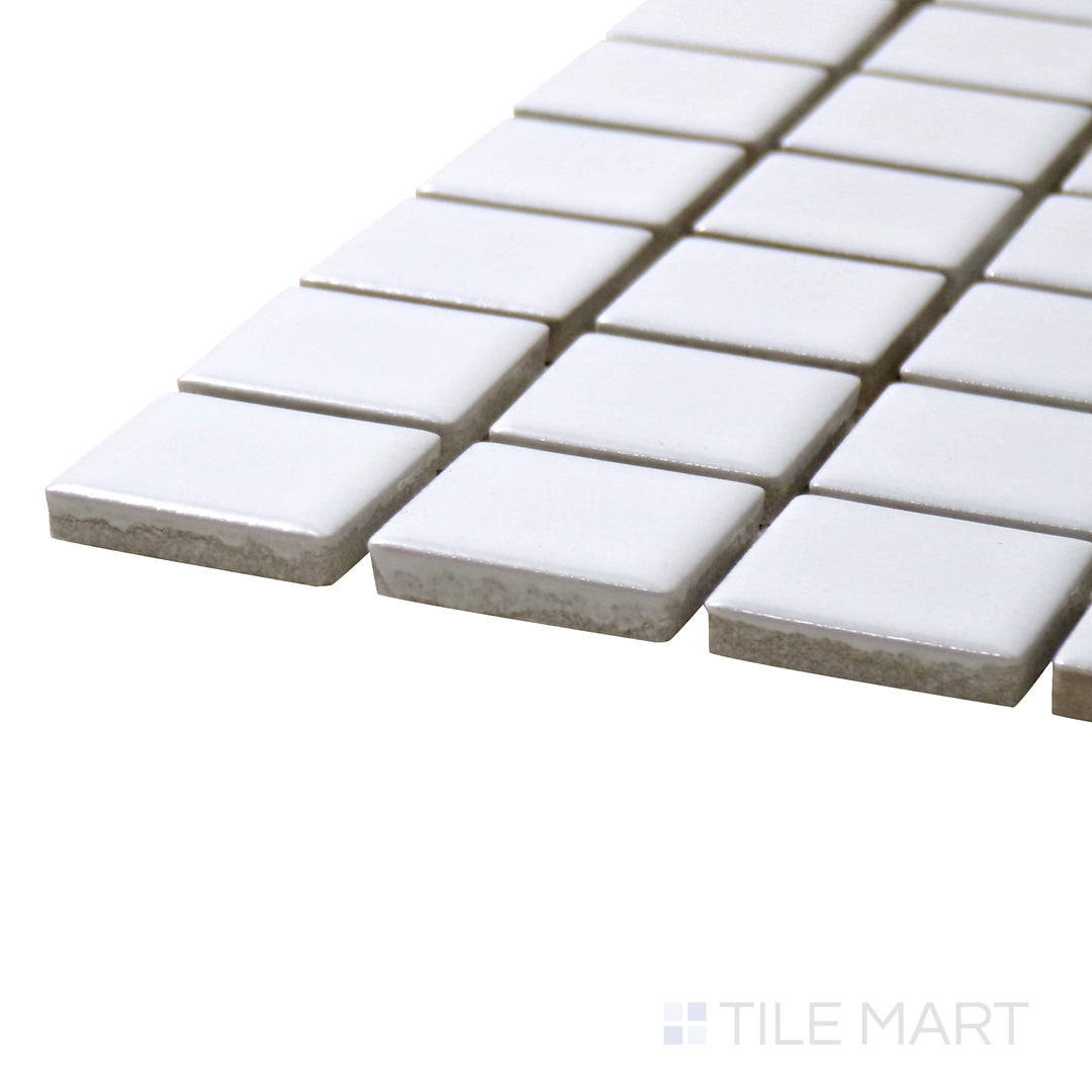 A corner perspective of the Porcelain Glazed Mosaics White 1" Square Matte tile highlights its bright white surface and classic square design, offering a timeless appeal.