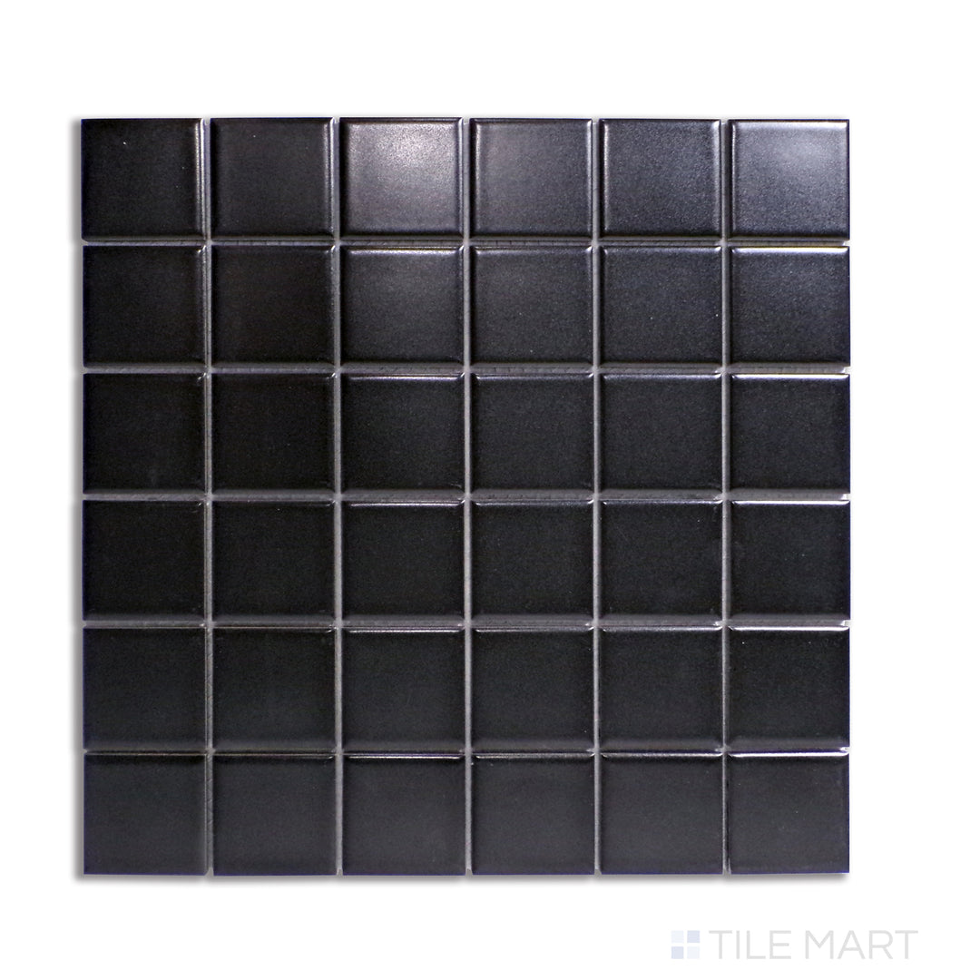 Overhead view of 2-inch square black matte porcelain mosaic tiles, adding depth and contrast to any design.