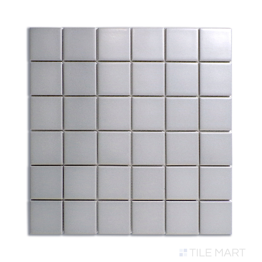 Top-down perspective of gray matte-finished porcelain mosaic tiles, giving a subtle yet sophisticated look.