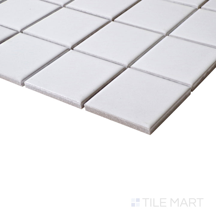 A clean and modern angle showcasing the soft, matte finish of White 2" Square Porcelain Glazed Mosaics, perfect for elegant interiors.