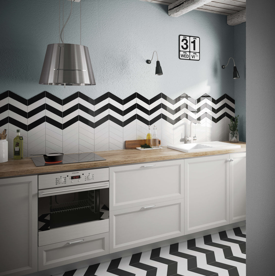 A striking room scene featuring Shapes Black Chevron Glossy Porcelain Mosaic, adding depth and dynamic movement to the space with its bold pattern.