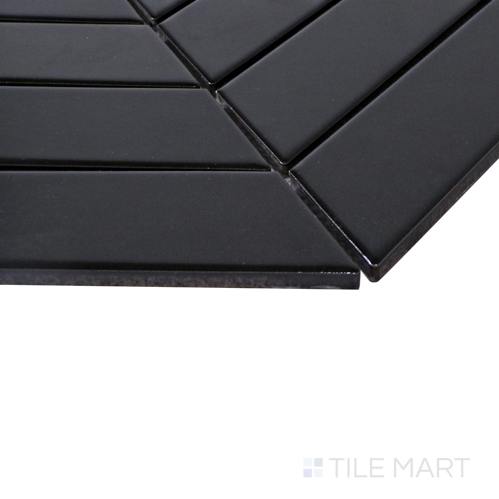 A textured close-up of Black Chevron Matte Porcelain Mosaic, offering a bold and contemporary look with a soft, matte finish.