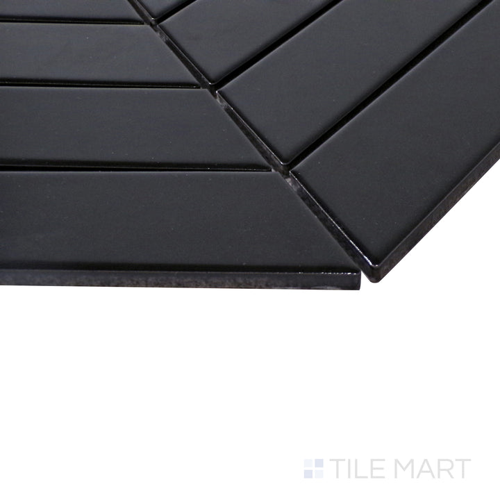 A textured close-up of Black Chevron Matte Porcelain Mosaic, offering a bold and contemporary look with a soft, matte finish.