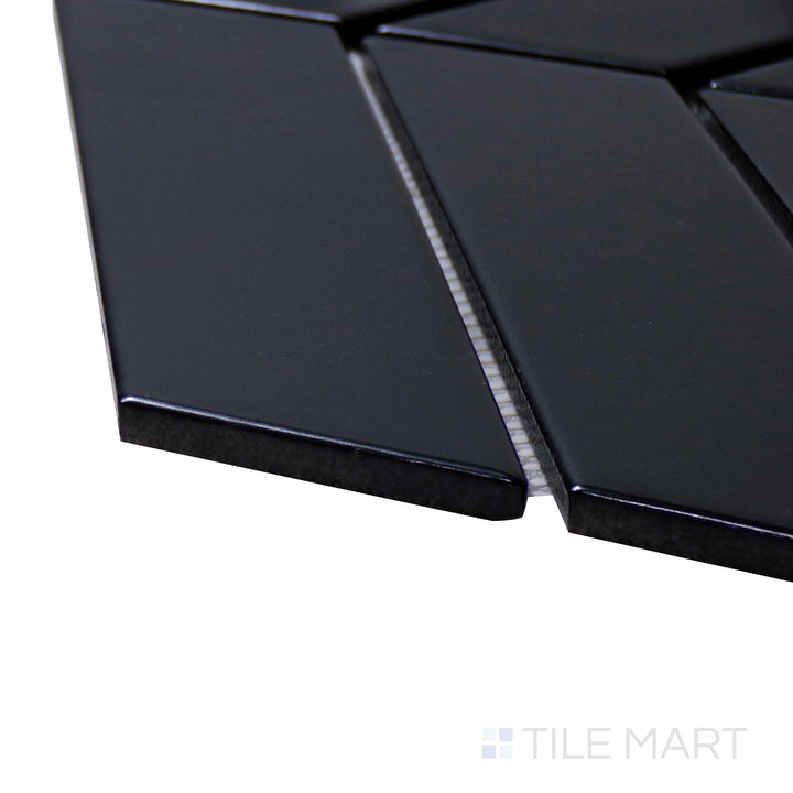 A corner perspective of the Shapes Black Chevron Matte Porcelain Mosaic tile emphasizes its deep black tone and matte surface, ideal for stylish and moody interiors.