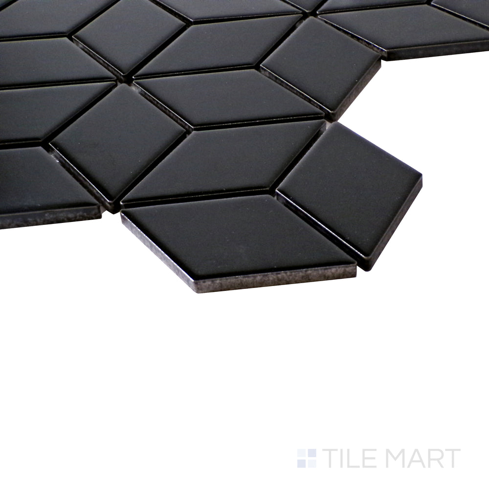 An angled view emphasizing the dimensional depth and high-gloss shine of Black Cube Glossy Porcelain Mosaic.