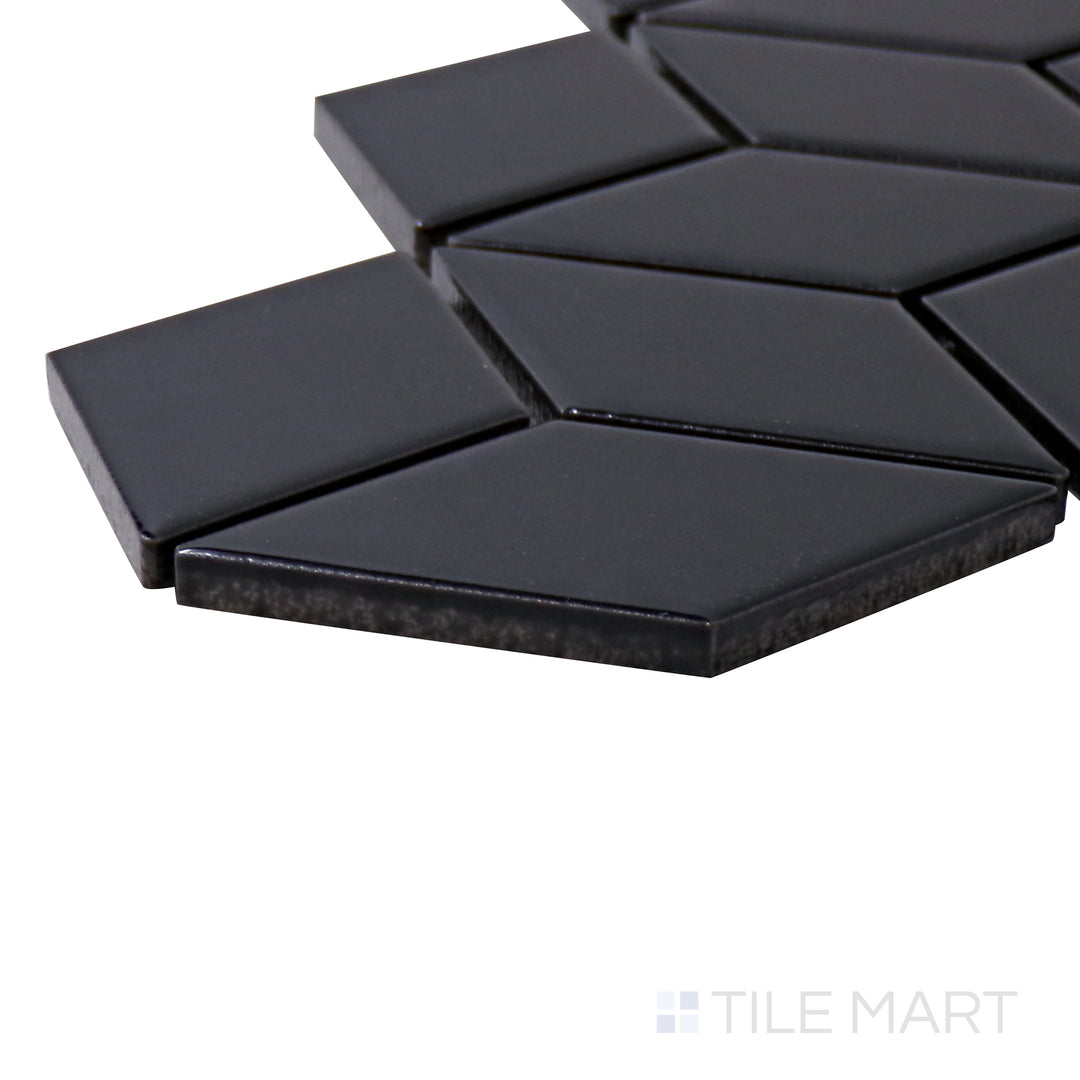 Captured from a corner angle, the Shapes Black Cube Glossy Porcelain Mosaic tile showcases its 3D cube effect with a high-gloss surface, adding depth and dimension.