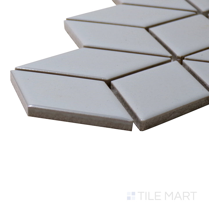 A corner perspective of the Shapes Light Gray Cube Glossy Porcelain Mosaic tile highlights its soft gray tones and glossy finish, perfect for contemporary geometric designs.