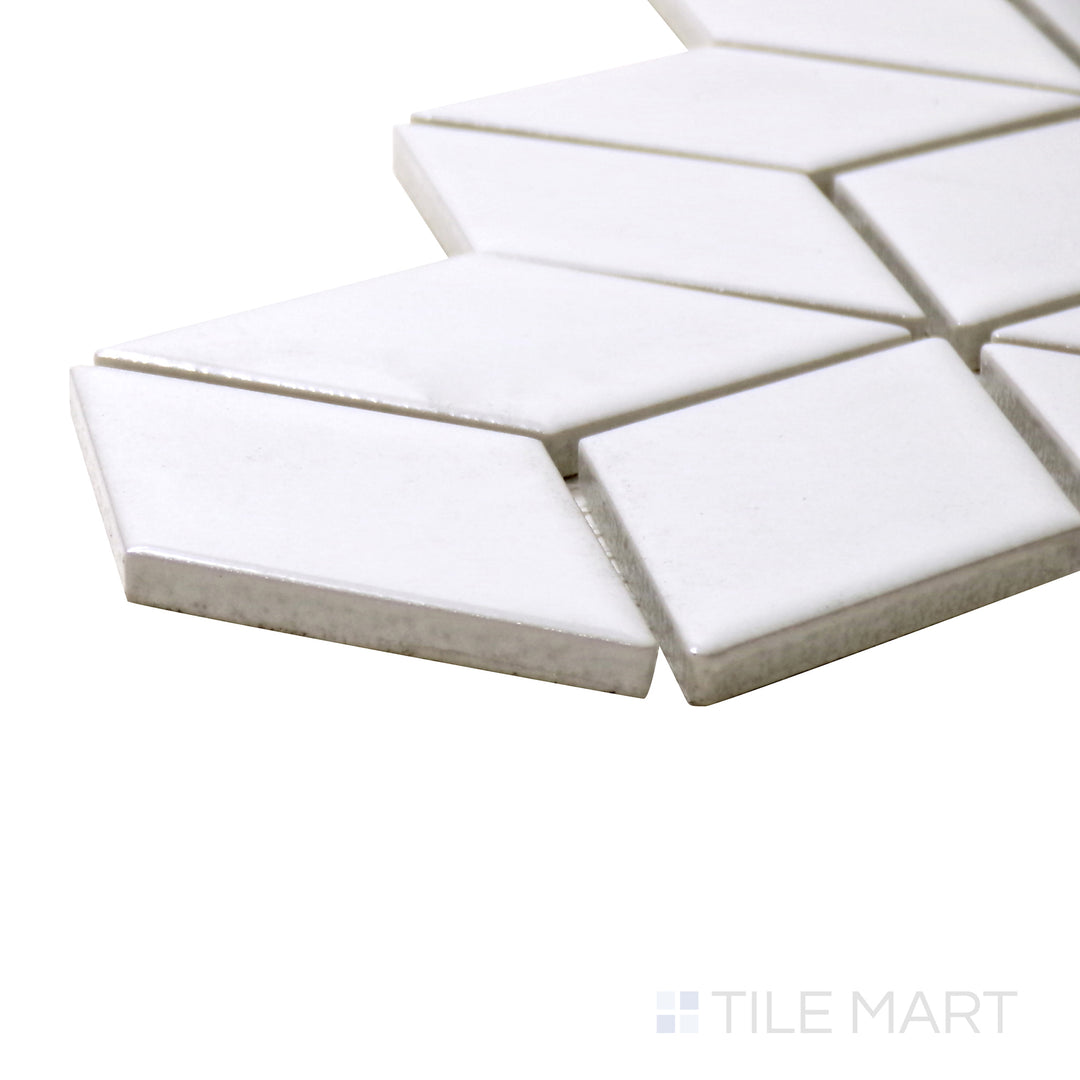 A corner shot of the Shapes White Cube Glossy Porcelain Mosaic tile presents its clean white look and striking cube illusion, enhancing walls and backsplashes.