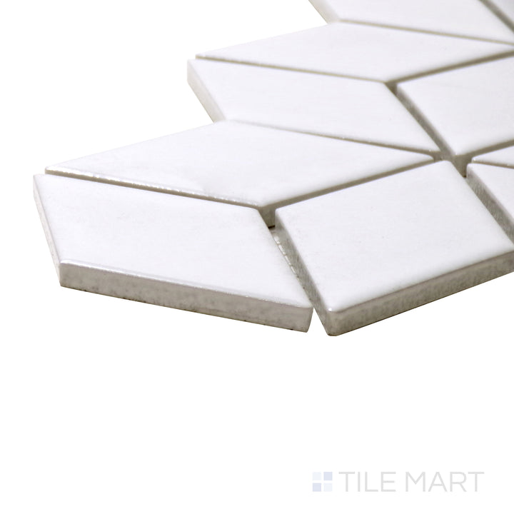 A corner shot of the Shapes White Cube Glossy Porcelain Mosaic tile presents its clean white look and striking cube illusion, enhancing walls and backsplashes.