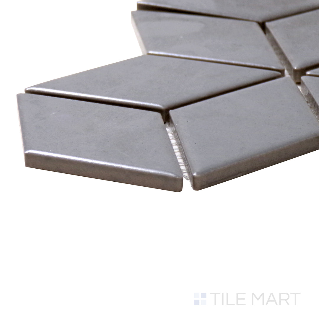 A corner perspective of the Shapes Light Gray Cube Matte Porcelain Mosaic tile highlights its neutral gray palette and sleek matte finish, adding depth to modern interiors.