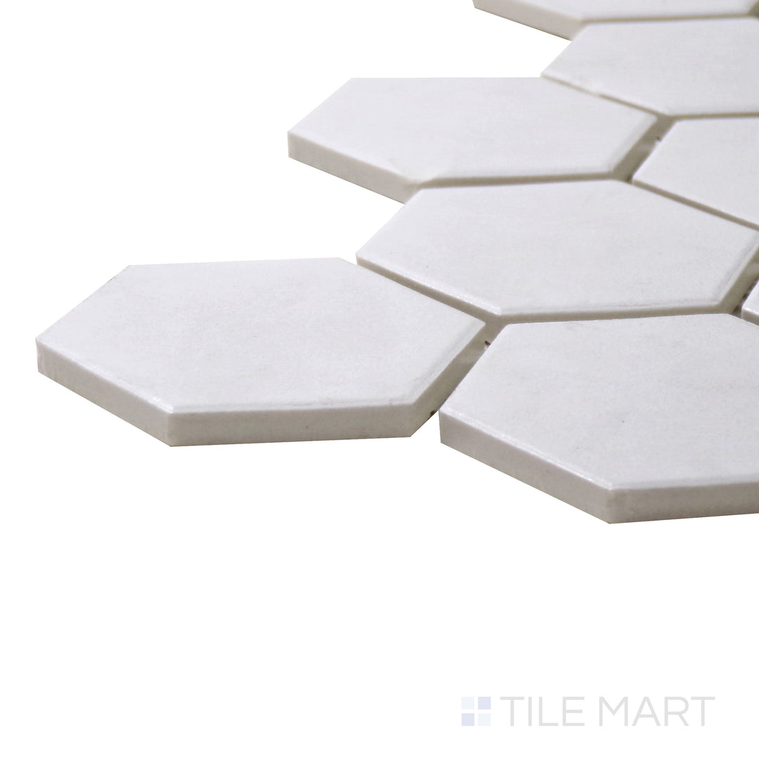 A corner perspective of the Solids White 2" Hexagon Matte Porcelain Mosaic tile highlights its crisp white finish and geometric hexagonal format, perfect for timeless designs.
