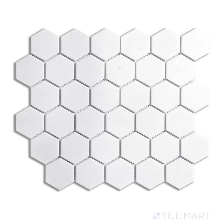 Overhead shot of white 2-inch hexagon matte porcelain mosaic tiles, delivering a crisp and structured aesthetic ideal for clean, minimalist designs.
