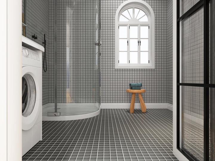 A bold and structured room scene highlighting Solids Black 2" Square Matte Porcelain Mosaic, offering a classic yet edgy design element.