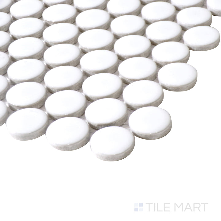 Close-up angle showcases the bright white surface and high-shine finish of Pure White Penny Round Glossy Porcelain Mosaic, creating a luminous effect.