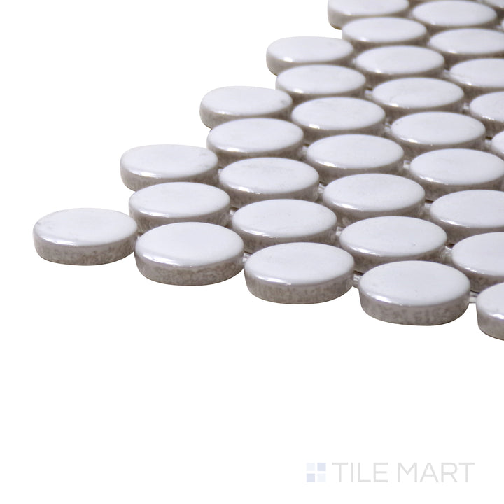 A corner perspective of the Pure White Penny Round Glossy Porcelain Mosaic showcases its crisp white shade and polished glossy finish, creating a clean and sophisticated aesthetic.