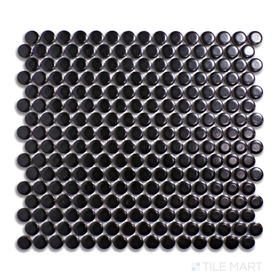 Aerial perspective of matte black penny round porcelain mosaic tiles, featuring a non-reflective surface that adds texture and depth to bold designs.