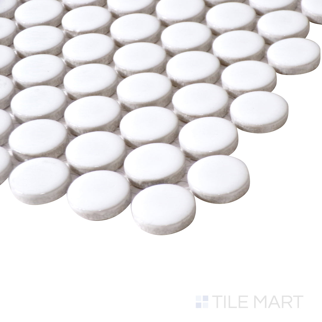 Angled close-up brings out the fresh white color and smooth matte texture of Pure White Penny Round Matte Porcelain Mosaic for a contemporary appeal.