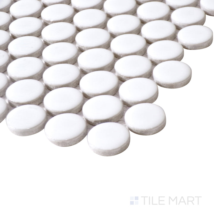 Angled close-up brings out the fresh white color and smooth matte texture of Pure White Penny Round Matte Porcelain Mosaic for a contemporary appeal.